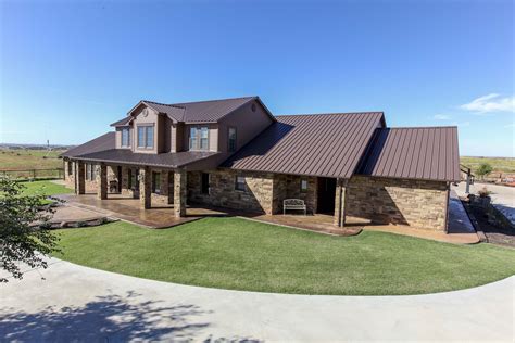 tan brick house with metal roof|metal roofed brick house.